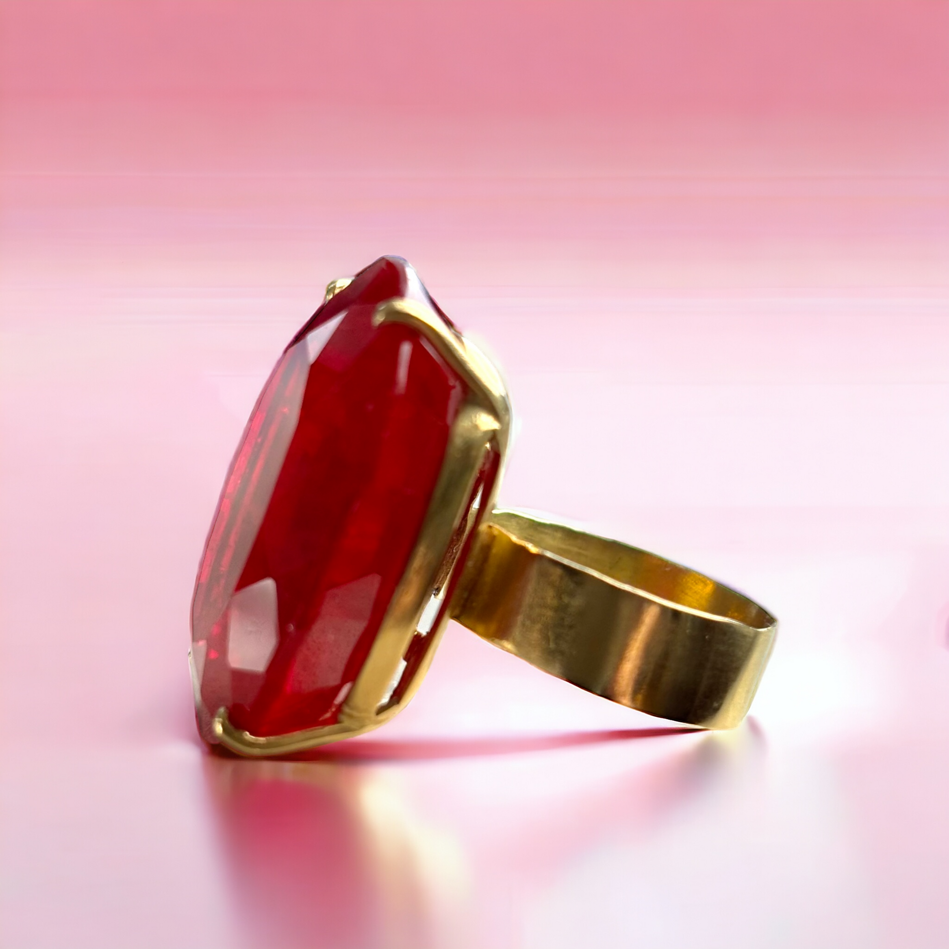 18k Yellow Gold Rubellite Ring, Large Oval Rubellite and wide band ring on a pink background