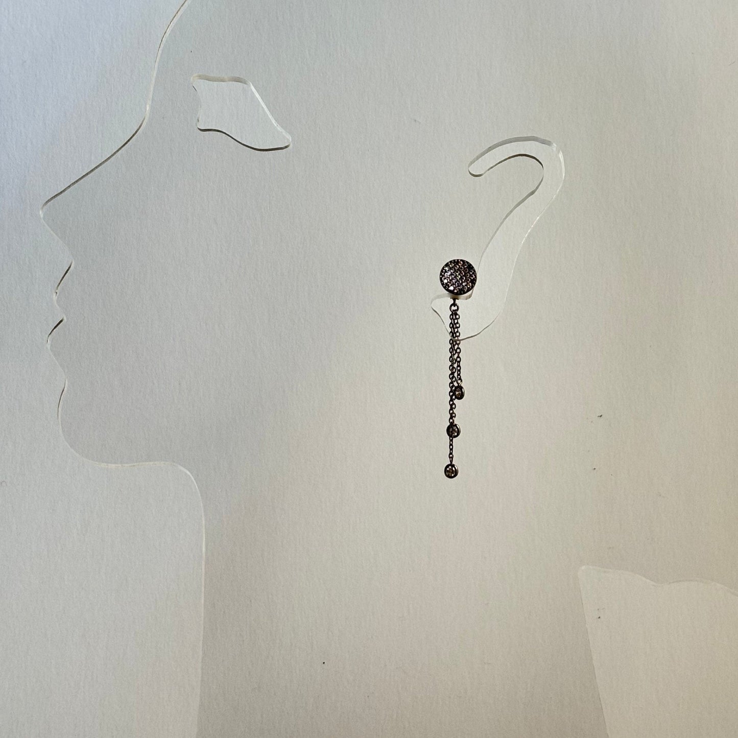 18k Black Gold Drop Chain Earrings with Sparkling Cubic Zirconium on a model