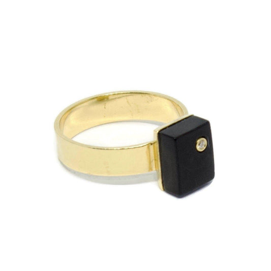 Black Onyx and Diamond Gold Cocktail Ring. Made from 18k solid gold, this statement ring has a black onyx stone with a diamond at its heart.