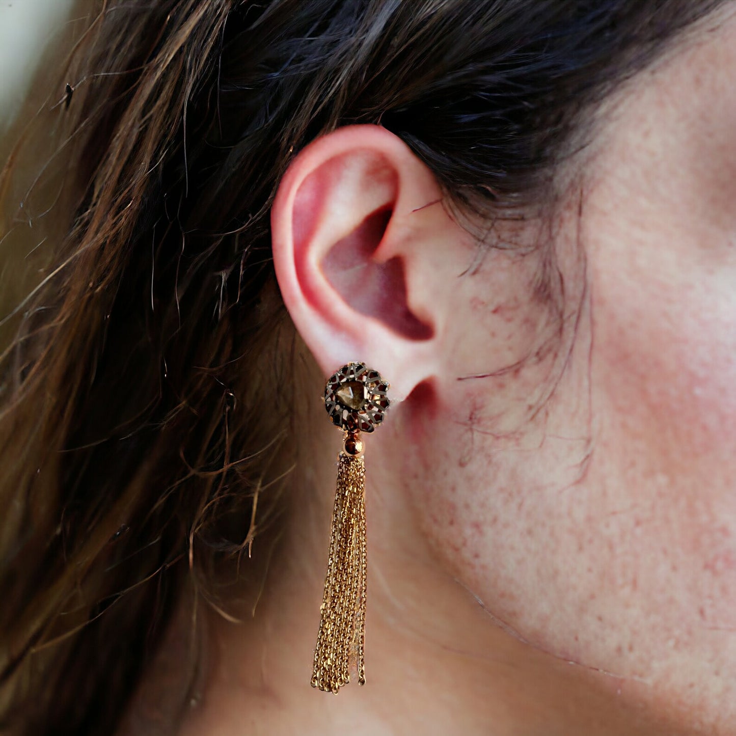 a model showing falamank rose and black diamond earrings