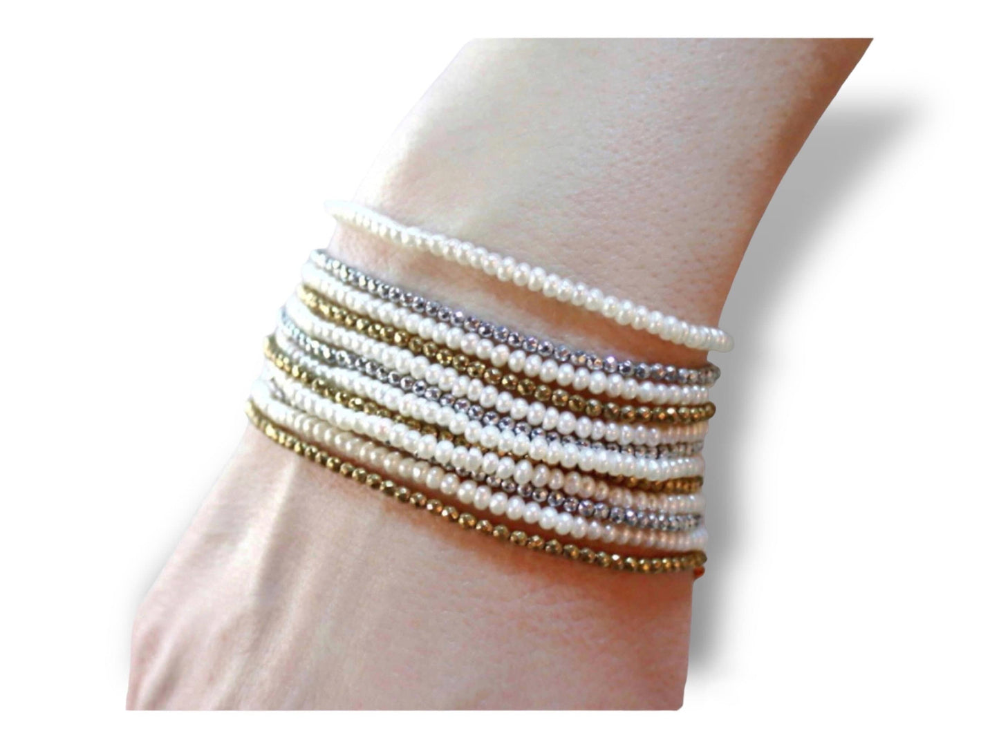 18k Gold Bracelet, interchanging rows of pearls and shimmering hematite, in yellow and silver tones.